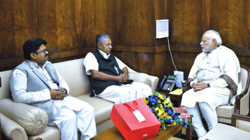Chief Minister Pinarayi Vijayan meets Prime Minister Narendra Modi in New Delhi on Monday. K.K. Ragesh, MP, is also seen.