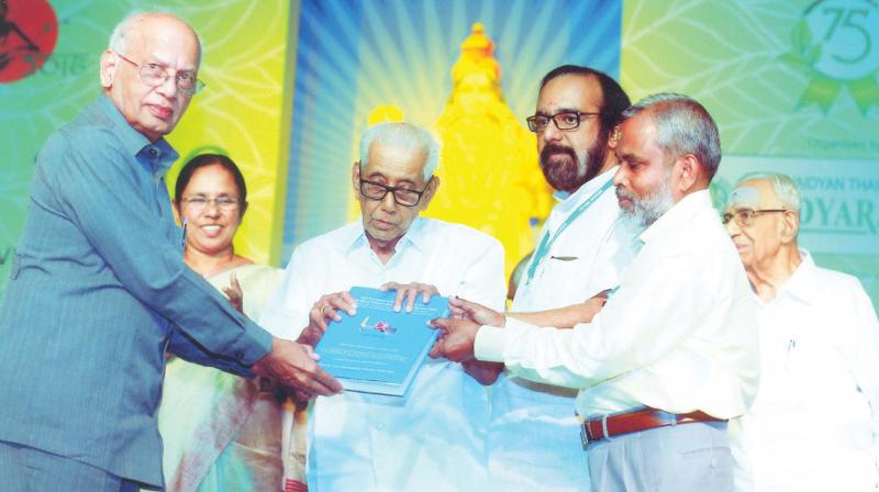 Former vice-chancellor of Manipal University and well-known cardiac surgeon Dr. M. S. Valiathan hands over the book Rare Methods of Treatment by Ashtvaidyan E.T. Neelakandan Mooss to Ashtavaidyan E.T. Narayanan Mooss in Thrissur on Monday. Dr P.K. Dharmapalan who compiled the book and health minister K.K. Shylaja are also seen