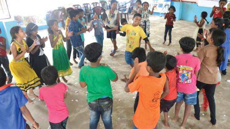 Children at Rajaji Nagar colony in Thiruvananthapuram take part in the talent development programme on Monday. (Photo: DC)