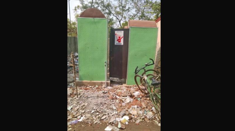 A public toilet at Besant Nagar is in shambles. (Photo: DC)