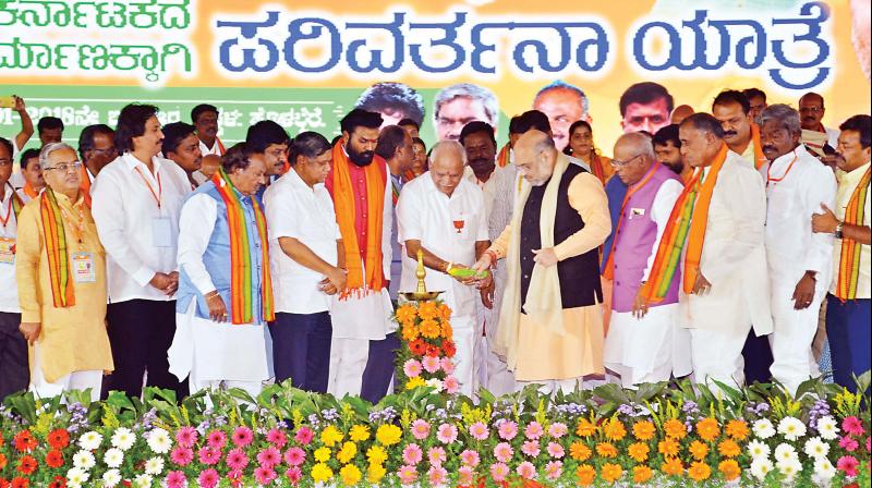 BJP president Amit Shah receives at a Parivartan Yatra, near Bengaluru on Wednesday. (Photo: PTI)