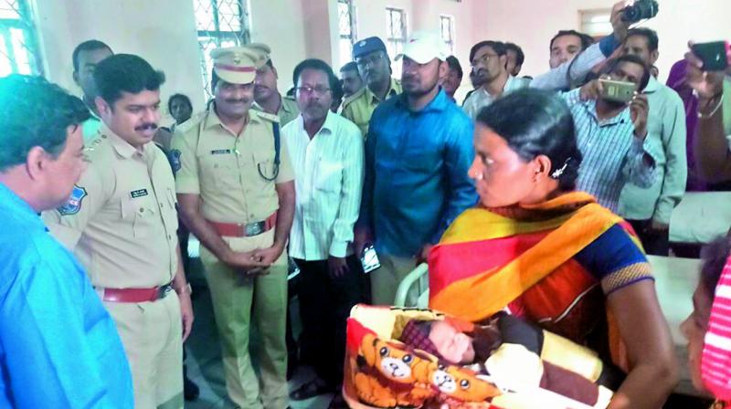 Adilabad police hands over the stolen baby to the biological parents at RIMS in Adilabad on Tuesday. 	(Image: DC)