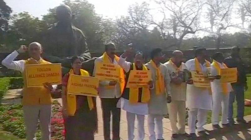 TDP members protested in the Well demanding special package for Andhra Pradesh while those from the TRS sought increase in reservation quota in Telangana. (Photo: ANI | Twitter)