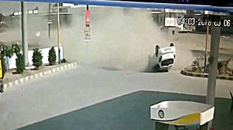 A harrowing footage from Gujarat shows a speeding SUV lose control and turtle turtle, in the process crashing into a pavement leading to a petrol pump. (Photo: Screengrab | ANI)