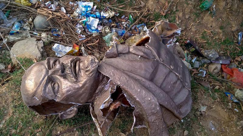 Remains of the five-feet-tall statue of Lenin which was allegedly demolished by a pay-loader at Belonia in South Tripura district on Monday afternoon and was thrown at the nearby jungle. (Photo: PTI)