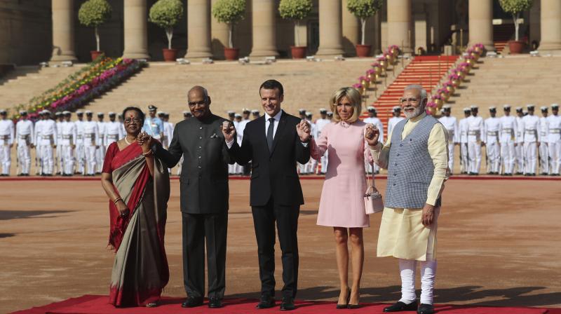 French President Emmanuel Macron began his official engagements on Saturday morning, when he was given a ceremonial welcome at the Rashtrapati Bhavan in Delhi. (Photo: AP)