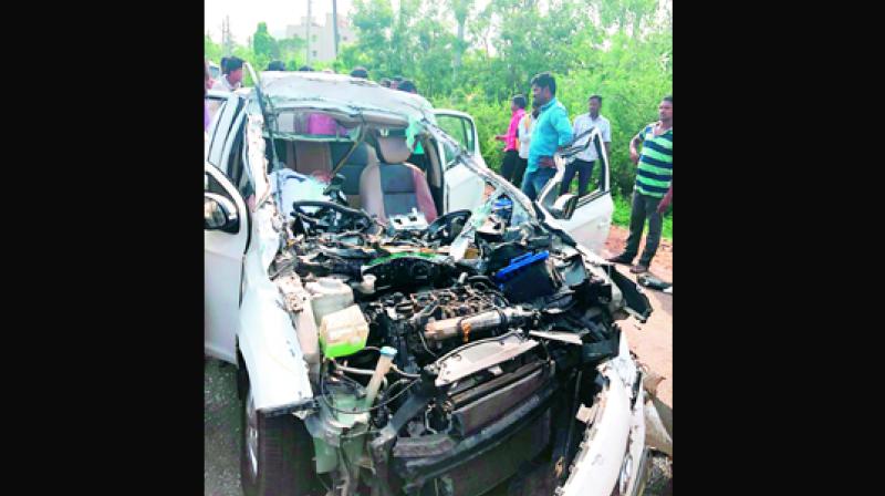 The mangled remains of the car at the accident spot near Anandapuram in Visakhapatnam on Saturday (Photo: DC)