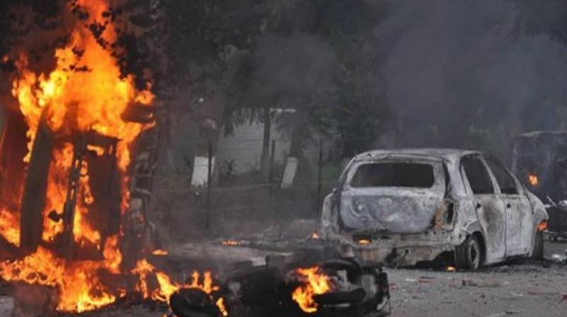 Vehicles burn in violence following Dera Sacha Sauda chief Gurmeet Ram Rahims conviction in Panchkula on Friday. (Photo: PTI)