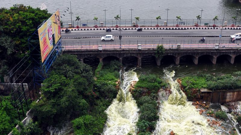 Hussainsagar lake overflows as the flood gates of the lake were opened due to heavy rains on Saturday. (Photo: DC)