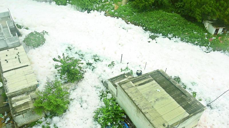 Froth from the Dharaninagar nala flows into the nearby houses following heavy rains that lashed the city on Friday night. (Photo: R. Pavan)