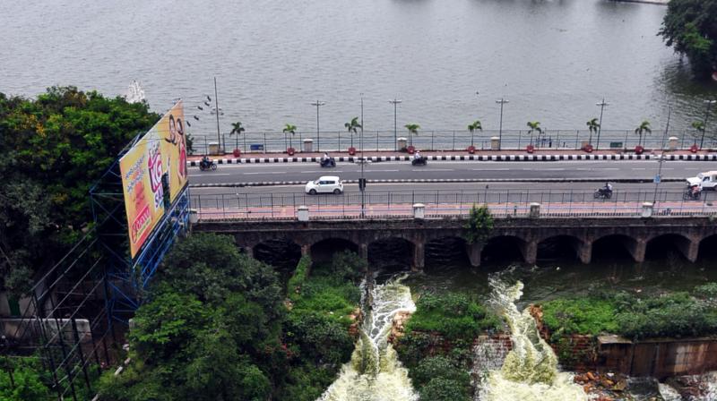 Hussainsagar lake overflows as the flood gates of the lake were opened due to heavy rains on Saturday. (Photo: DC)