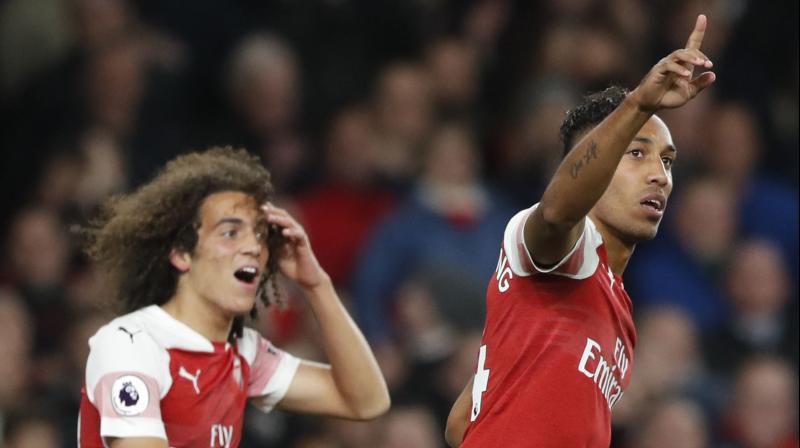 Pierre-Emerick Aubameyang and Mesut Ozil stole the show as Arsenal swept to their 10th successive win with a dominant 3-1 victory against Leicester City. (Photo: AP)