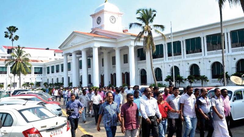 Pro-UDF Secretariat staff take out a procession after availing a days leave on Monday. (Photo: DC)