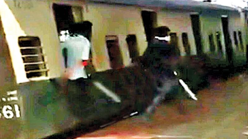 College students with weapons go amok at Pattaravakkam railway station on Tuesday (Photo: DC)