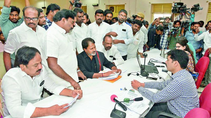 Former minister M. Venkataraman, along with other YSRC leaders, submit a memorandum to Guntur collector K. Sashidar, demanding action against MLA Anagani Satya Prasad in land grabbing issue in Dindi village of Nizampatnam mandal. (Photo: DC)