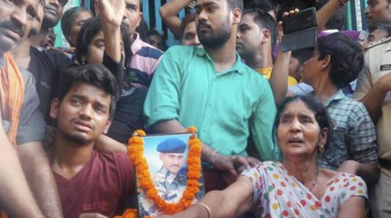 CRPF martyr Krishna Kumar Pandeys family members and relatives mourn during his funeral in Rohtas, Bihar on Wednesday. (Photo: PTI)