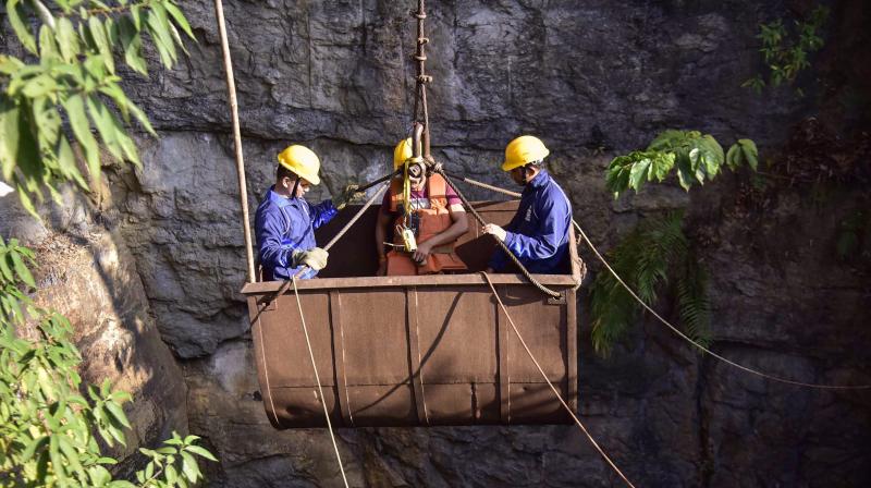 Navy personnel conduct a rescue task at the site of a coal mine collapse at Ksan, in Jaintia Hills district of Meghalaya on Saturday. (Photo: PTI)