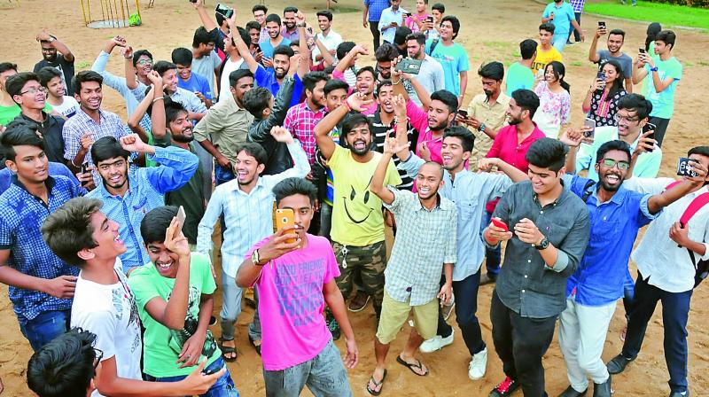 Youngsters clicking selfie at the event held at the Sanjeevaiah Park.
