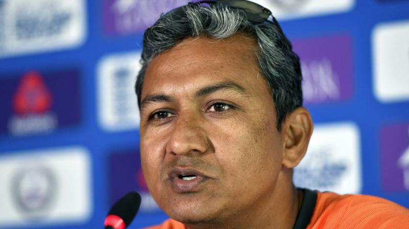 Indias assistant coach Sanjay Bangar on Monday came to the defence of the under-fire Mahendra Singh Dhoni, saying losing wickets at regular intervals did not allow the veteran campaigner to play freely in the second ODI at Lords. (Photo: AP)