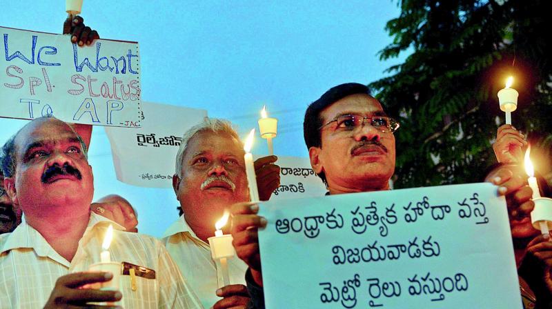 Members of special status Joint Action Committee take out a candlelight rally seeking special status at IGM stadium in Vijayawada on Tuesday. (Photo: DC)