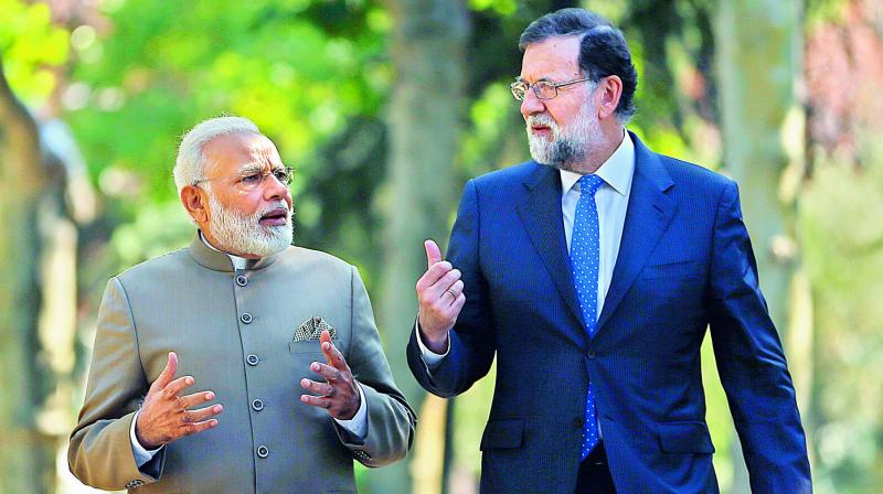 Prime Minister Narendra Modi with Spanish Premier Mariano Rajoy in the gardens of the Moncloa Palace in Madrid, Spain on Wednesday. (Photo: PTI)
