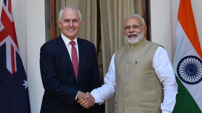 Prime Minister Narendra Modi shakes hands with his Australian counterpart Malcolm Turnbull. (Photo: PTI)
