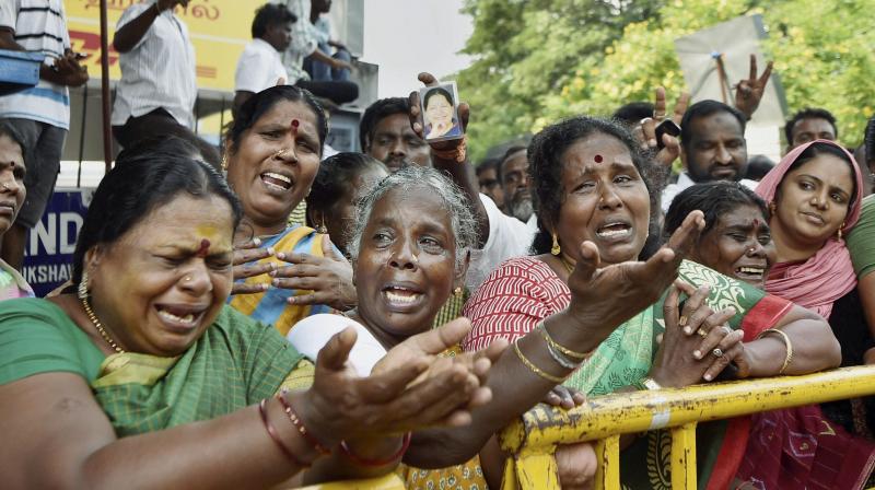 Supporters of Tamil Nadu Chief Minister Jayalalithaa cry after her death. (Photo: PTI)
