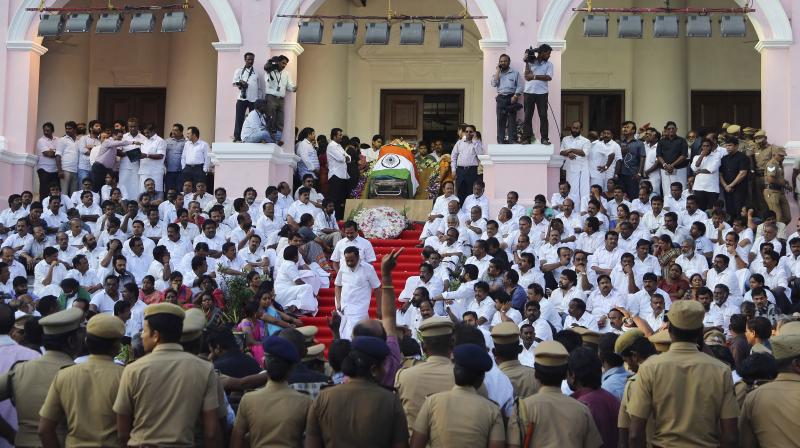 Body of late Tamil Nadu Chief Minister Jayaram Jayalalithaa is wrapped in the national flag and kept for public viewing outside Rajaji Hall in Chennai.