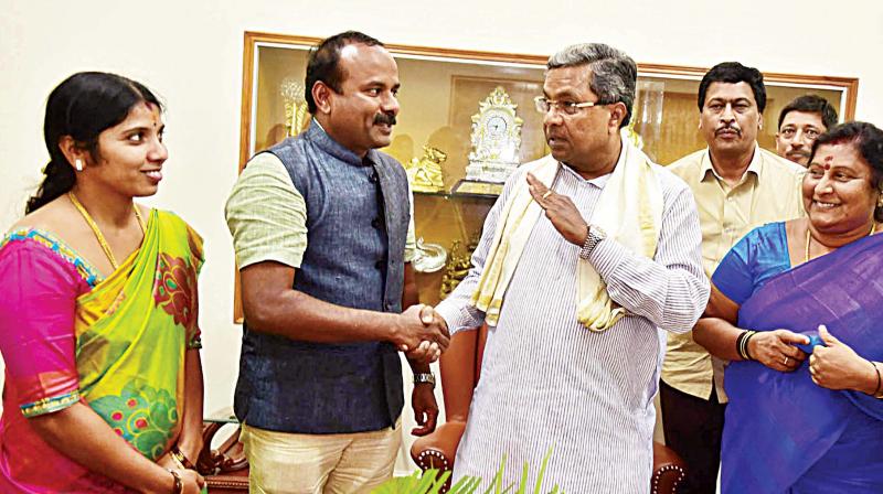 CM Siddaramaiah greets newly elected Mayor Sampath Raj of Congress and Dy Mayor Padmavathi Narasimha-murthy. (Photo: KPN)