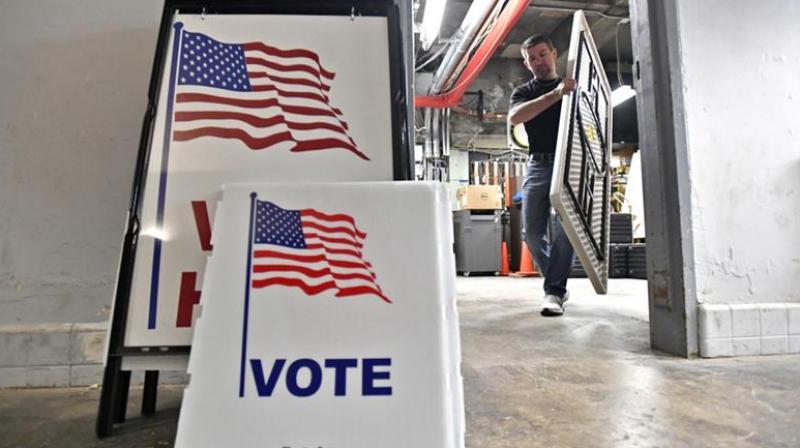 There is no current national database of voter registration in the US because each state independently runs its own election, the report said. (Photo: AP)