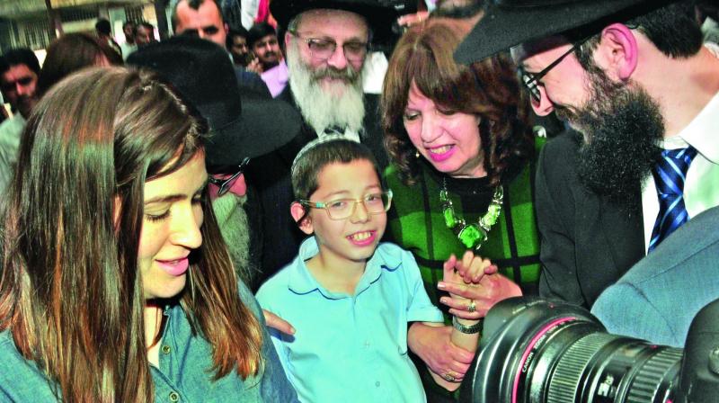Israeli boy Moshe Holtzberg arrives at Nariman House in Colaba, Mumbai on Tuesday. (Photo: Debasish Dey)