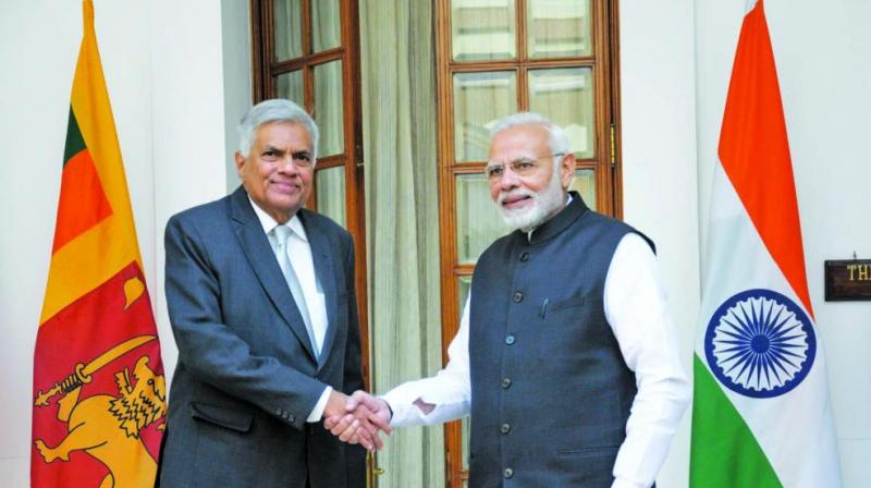 Prime Minister Narendra Modi shakes hands with his Sri Lankan counterpart Ranil Wickremesinghe ahead of a meeting at Hyderabad House in New Delhi. (Photo: Sondeep Shankar)