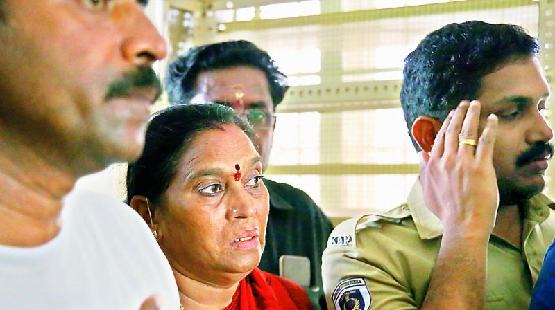 Police take Balamma, a native of Andhra Pradesh, to a hospital at Sabarimala Sannidhanam after she collapsed when protesters blocked her way on Sunday. (Via web)