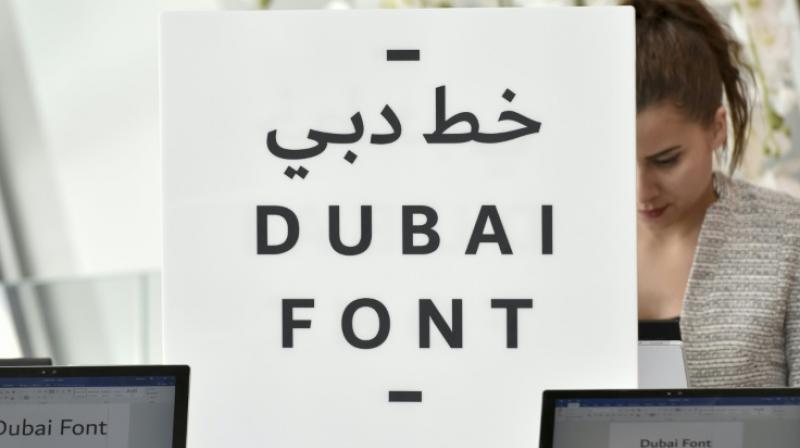 Computers showing the \Dubai Font\, the first typeface developed by Microsoft for Dubai, at its launch on April 30, 2017 (Photo: AFP)