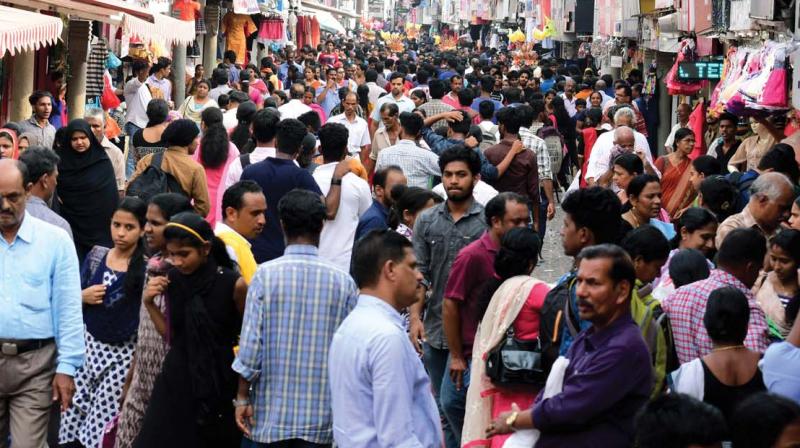 People throng SM Street for last-minute purchases on the eve of Vishu on Saturday. (Photo: DC)