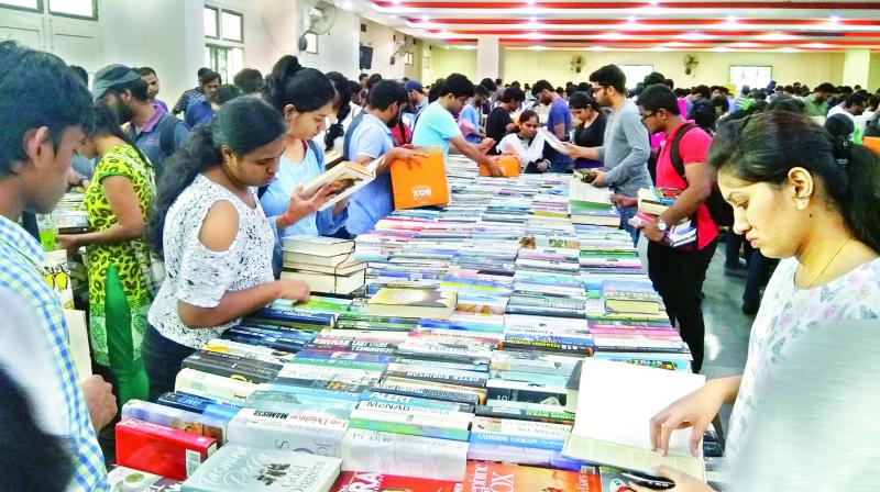 Book enthusiasts browsing through the huge array of books on display