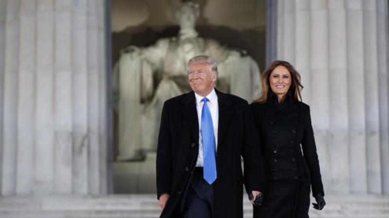 President-elect Donald Trump, left, and his wife Melania Trump arrive to the \Make America Great Again Welcome Concert\ at the Lincoln Memorial. (Photo: AP)