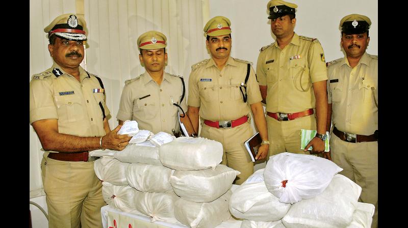 Bengaluru Police Commissioner T. Suneel Kumar, Additional Commissioner Seemanth Kumar Singh, DCP Dr Boralingaiah and DCP Karibasavnna Gowda display 22 kg of ganja seized in Mico Layout police station limits.