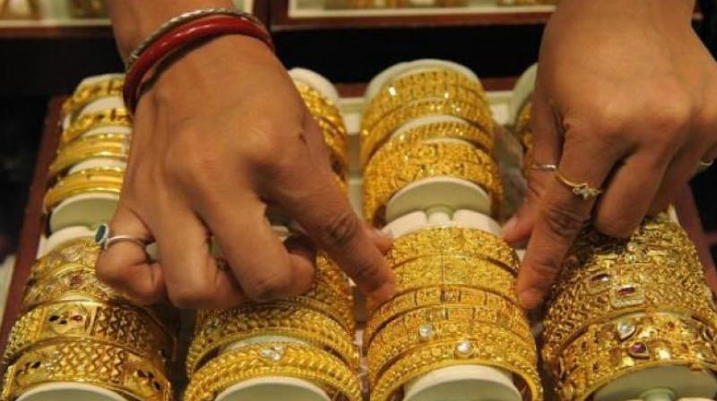 At the Multi Commodity Exchange, gold for delivery in April fell by or 0.23 per cent, to Rs 29,235 per 10 grams.