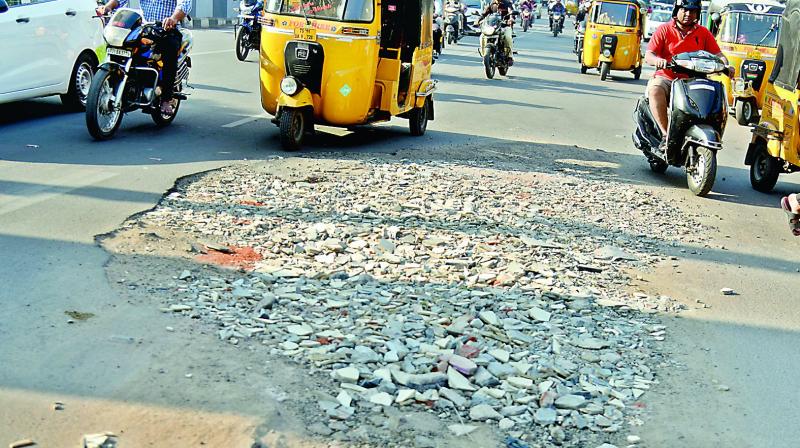 The heavily damaged road at Nampally left unattended by the civic body.