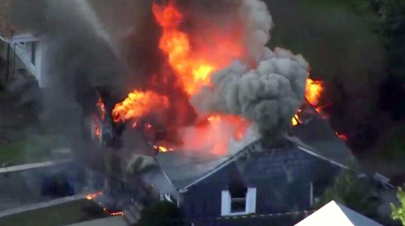 In this image take from video provided by WCVB in Boston, flames consume a home in Lawrence, Mass, a suburb of Boston. (Photo: AP)