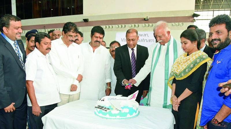 Civil aviation minister P. Ashok Gajapathi Raju, along with chief commercial officer of Sri Lankan Airlines Siva Ramachandran, cuts a cake at the inaugural flight from Sri Lanka to Visakhapatnam at Vizag Airport in Visakhapatnam on Saturday. (Photo: DC)
