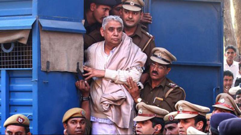 Rampal and 27 of his followers were charged with murder and wrongful confinement after four women and a child were found dead in his Satlok Ashram in Barwala town in Hisar on November 19, 2014. (Photo: PTI)