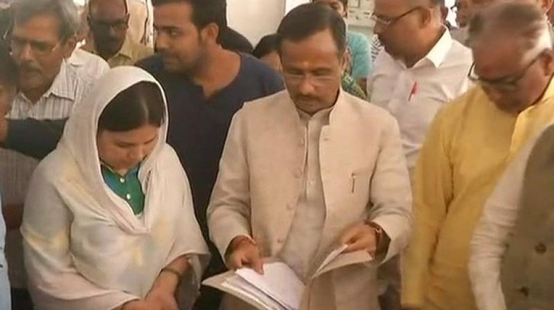 UP Deputy Chief Minister Dinesh Sharma on Thursday handed over an appointment letter for a government job to Kalpana Tiwari, the wife of Apple executive Vivek Tiwari who was shot dead by a police constable last month.