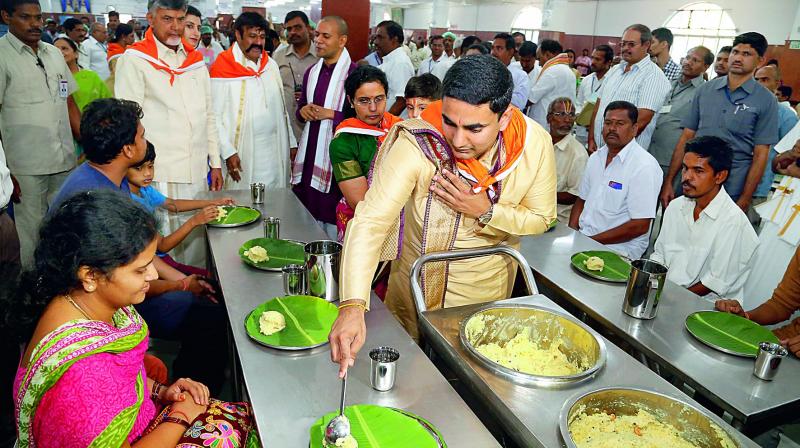 Family members of Chief Minister N. Chandrababu Naidu serve devotees at Annaprasadam building at Tirumala on Wednesday.