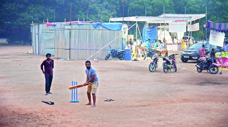 Youngsters play a game of cricket at the Marredpally playground opposite Shenoy Nursing home.