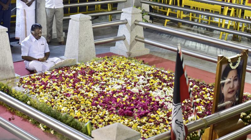 Tamil Nadu Chief Minister O Panneerselvam sitting in a meditation in front of late J Jayalalithaas burial site at the Marina Beach in Chennai. (Photo: PTI)