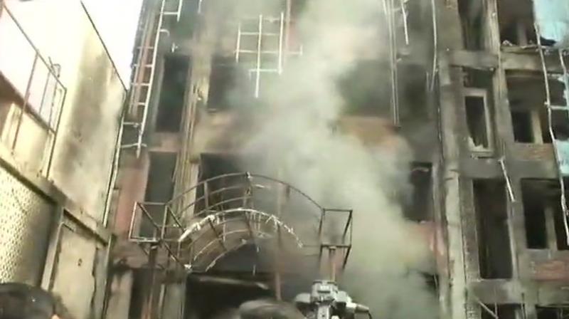 More than 50 people were rescued from the building. Cause of fire still to be ascertained, police said. (Photo: ANI | Twitter)