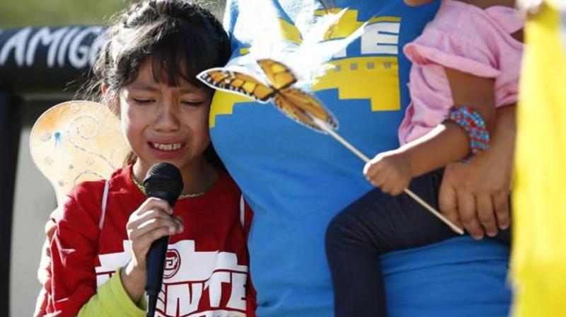 Akemi Vargas, 8, cries as she talks about being separated from her father during an immigration family separation protest in front of the Sandra Day OConnor US District Court building, in Phoenix. (Photo: AP)