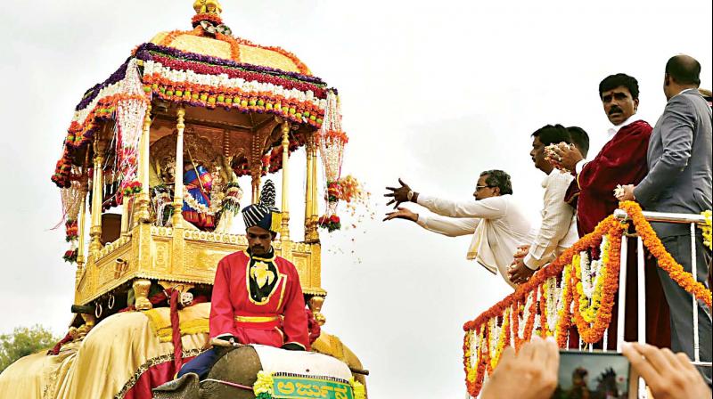 Karnataka CM Siddaramaiah offers pooja to Goddess Chamundeswari to mark the start of Jamboo Savari in Mysuru on Saturday. (Photo: DC)